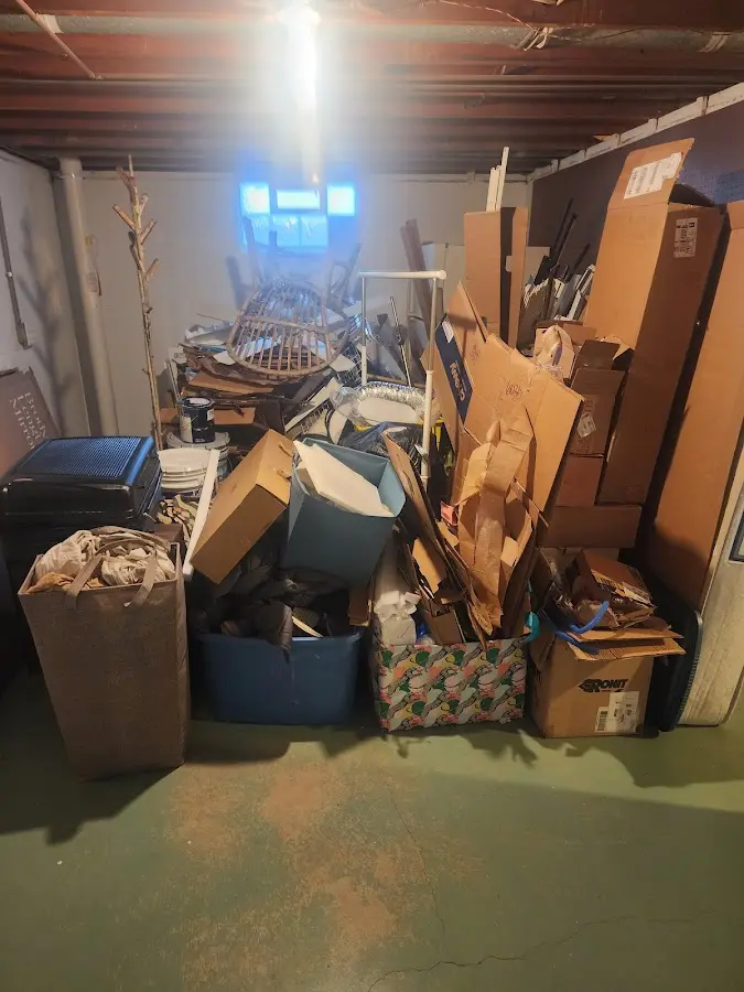 Roll-off dumpster container at job site for 2 Yard Dumpster Rental in Old Westbury